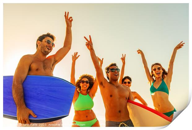 Friends enjoying carefree fun going bodyboarding on beach Print by Spotmatik 