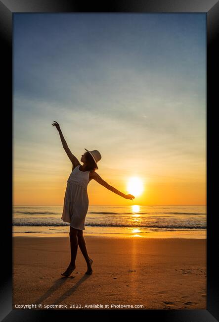Happy Afro American girl dancing on sunset beach Framed Print by Spotmatik 