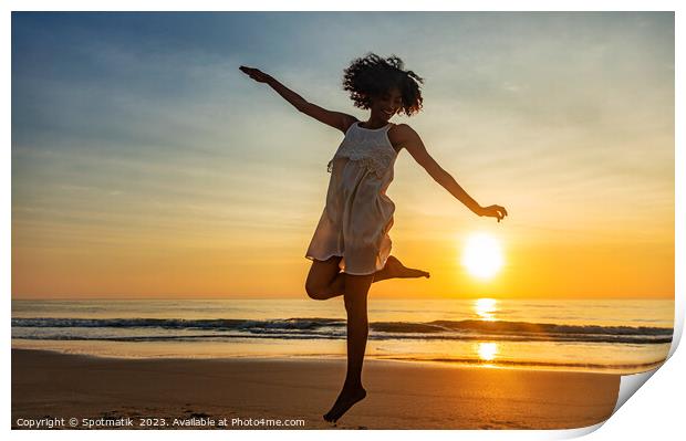 Barefoot young African American woman dancing on beach Print by Spotmatik 