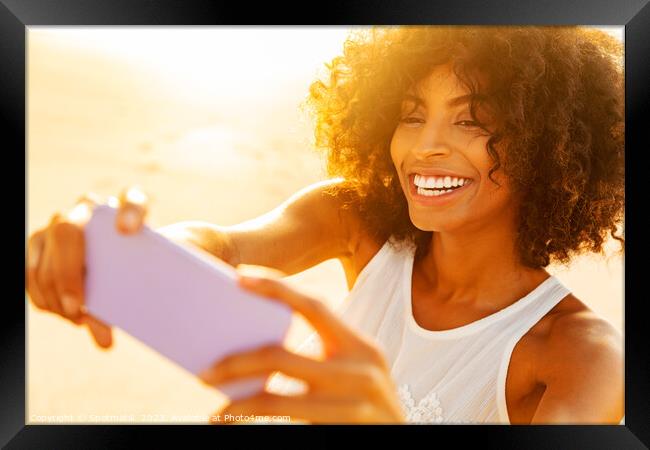 Afro American girl on beach vacation taking selfies Framed Print by Spotmatik 