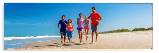 Panoramic view of friends jogging together on beach Acrylic by Spotmatik 