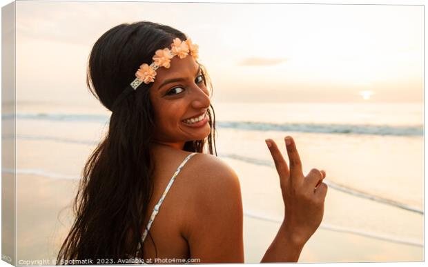 Happy Indian girl enjoying freedom outdoors on beach Canvas Print by Spotmatik 