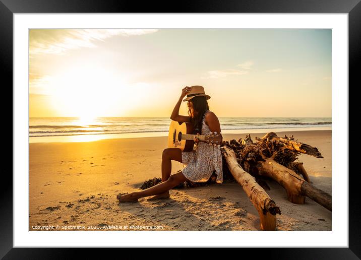 Indian female sitting on driftwood with ocean sunrise Framed Mounted Print by Spotmatik 