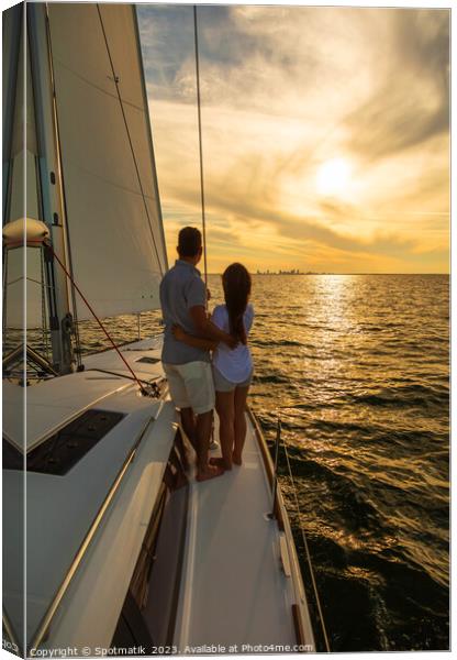 Sunset view for Latin American couple on yacht Canvas Print by Spotmatik 