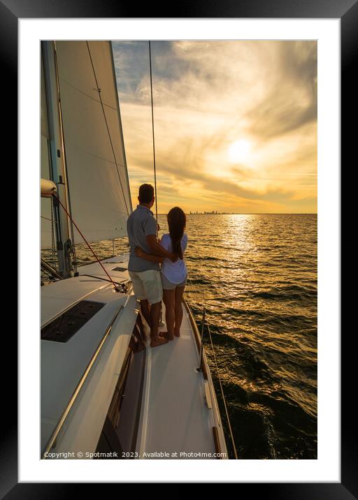 Sunset view for Latin American couple on yacht Framed Mounted Print by Spotmatik 