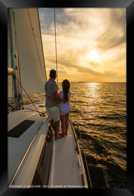 Sunset view for Latin American couple on yacht Framed Print by Spotmatik 