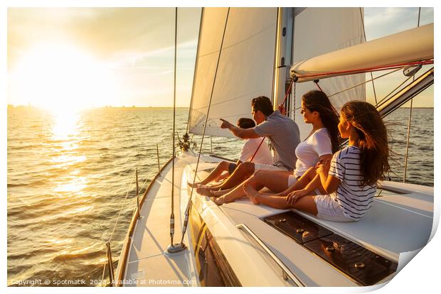 Relaxed family on luxury yacht sailing towards sunset Print by Spotmatik 