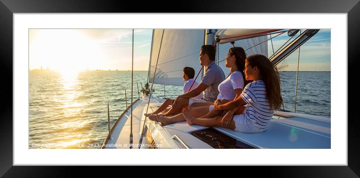 Panorama of Latin American family on sailing vacation at sunset Framed Mounted Print by Spotmatik 