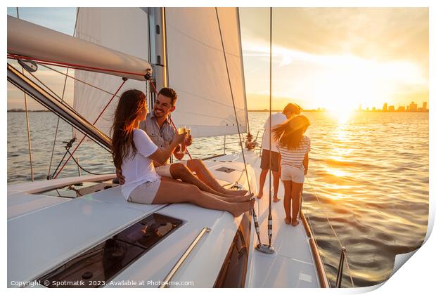 Young family having fun on yacht at sunset Print by Spotmatik 