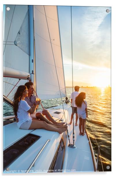 Hispanic family enjoying vacation on yacht at sunset Acrylic by Spotmatik 