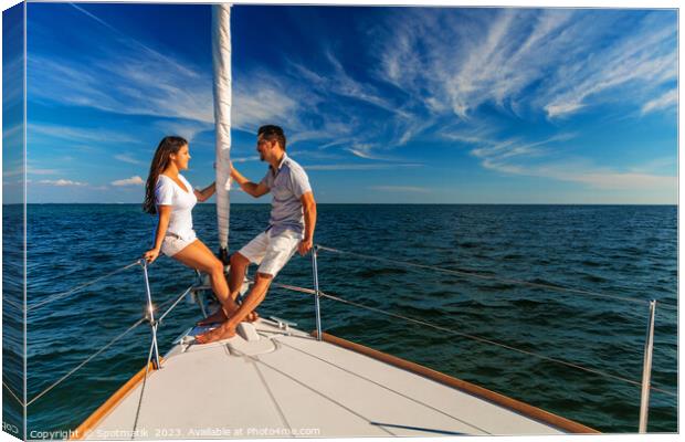 Hispanic couple enjoying luxury travel on private yacht Canvas Print by Spotmatik 