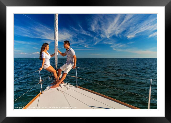 Hispanic couple enjoying luxury travel on private yacht Framed Mounted Print by Spotmatik 