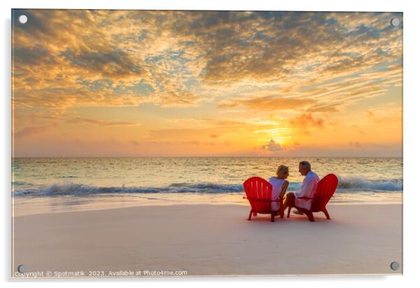 Mature couple enjoying ocean sunset on beach Bahamas Acrylic by Spotmatik 