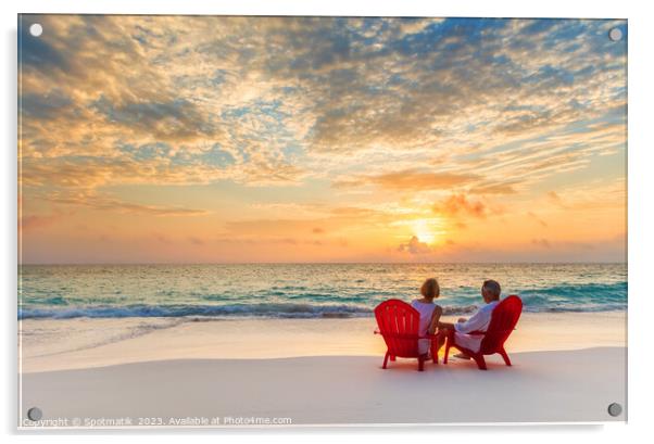 Retired couple enjoying tropical sunrise over ocean Bahamas Acrylic by Spotmatik 