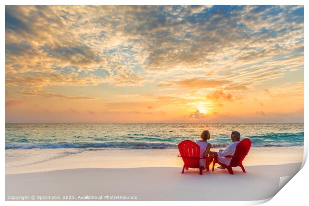 Retired couple enjoying tropical sunrise over ocean Bahamas Print by Spotmatik 