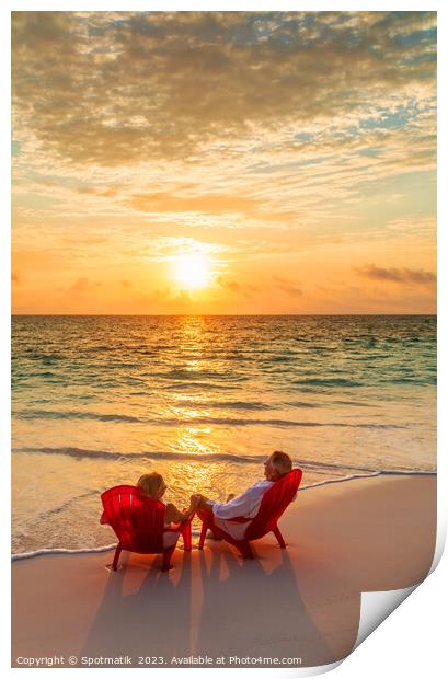Sunset view with retired couple relaxing by ocean Print by Spotmatik 