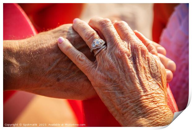 Linked hands of senior Caucasian couple on vacation Print by Spotmatik 