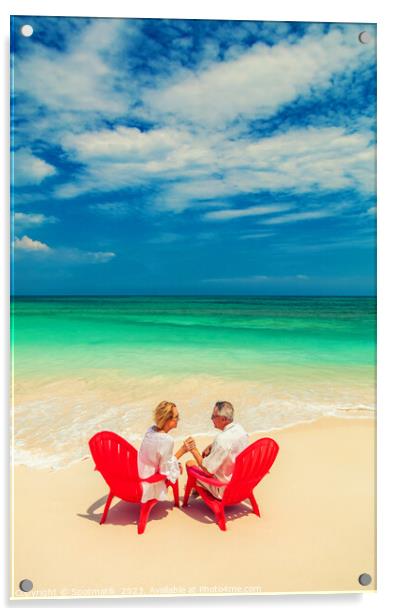 Mature couple on red chairs by ocean Bahamas Acrylic by Spotmatik 