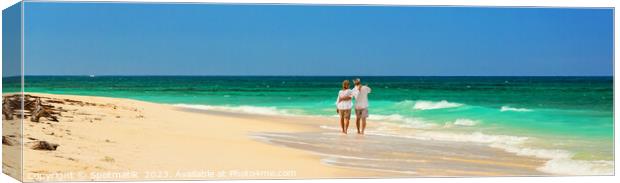 Panoramic view retired couple walking by turquoise ocean Canvas Print by Spotmatik 