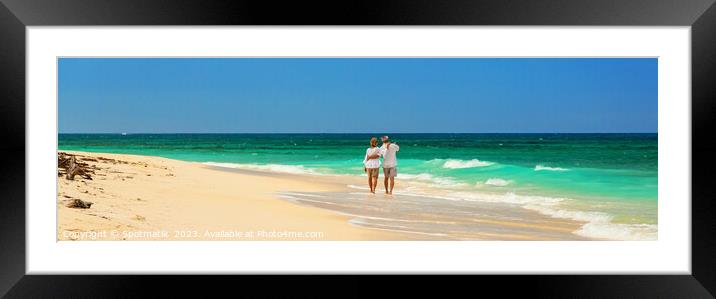 Panoramic view retired couple walking by turquoise ocean Framed Mounted Print by Spotmatik 