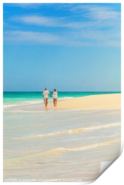 Mature couple walking on beach by ocean Bahamas Print by Spotmatik 