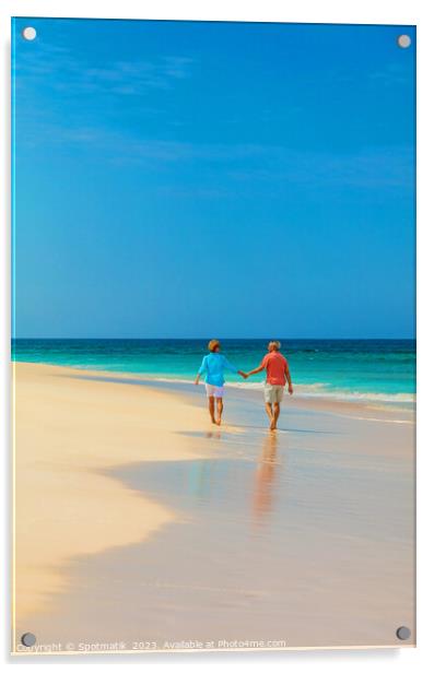 Retired couple holding hands enjoying walk on beach Acrylic by Spotmatik 