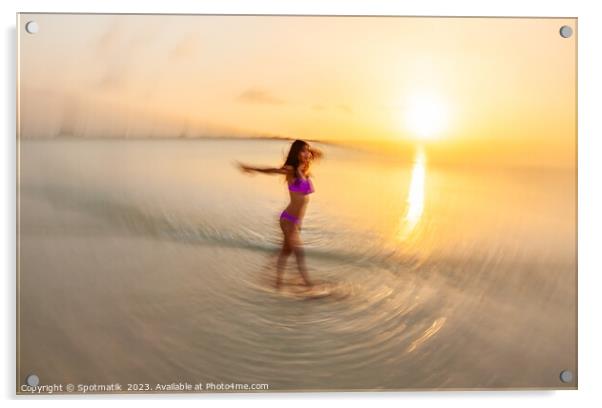 Motion blurred sunset ocean view with dancing female Acrylic by Spotmatik 