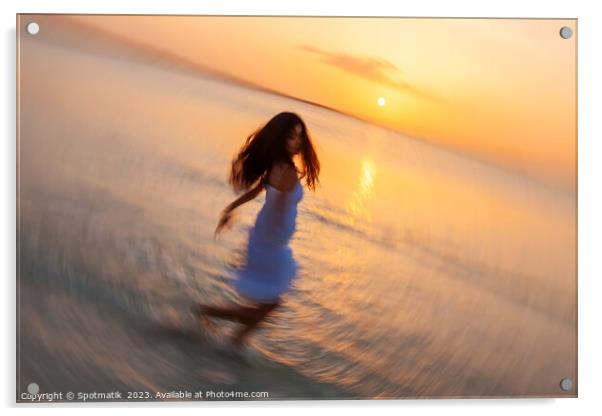 Motion blurred Asian girl dancing in ocean sunset Acrylic by Spotmatik 