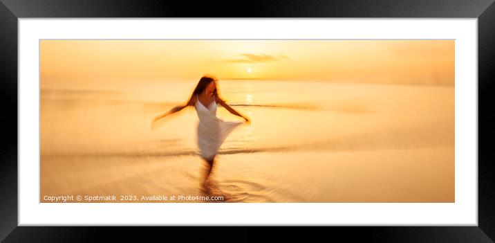 Panoramic motion blurred ocean sunset with dancing girl Framed Mounted Print by Spotmatik 