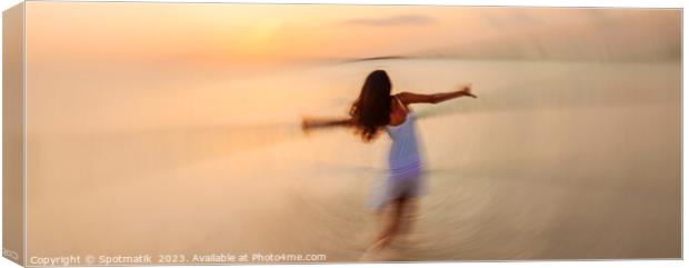 Motion blurred panoramic ocean sunset with dancing girl Canvas Print by Spotmatik 