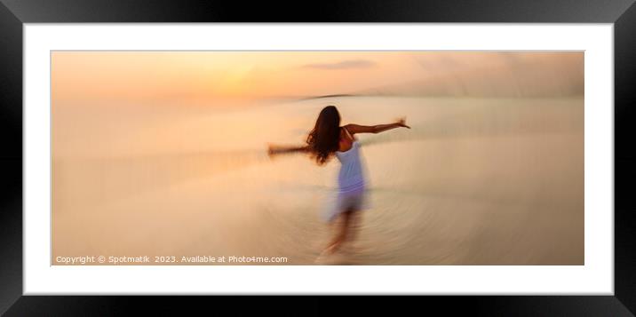 Motion blurred panoramic ocean sunset with dancing girl Framed Mounted Print by Spotmatik 
