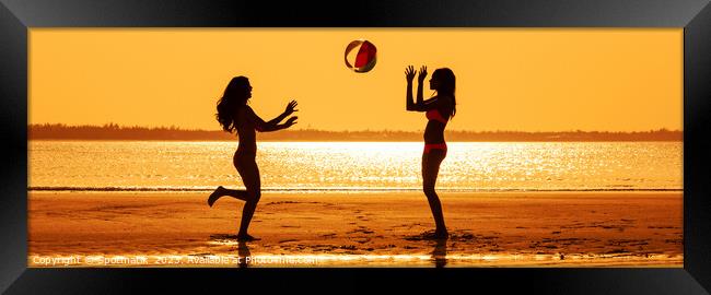 Panoramic silhouette friends with beach ball at sunset Framed Print by Spotmatik 