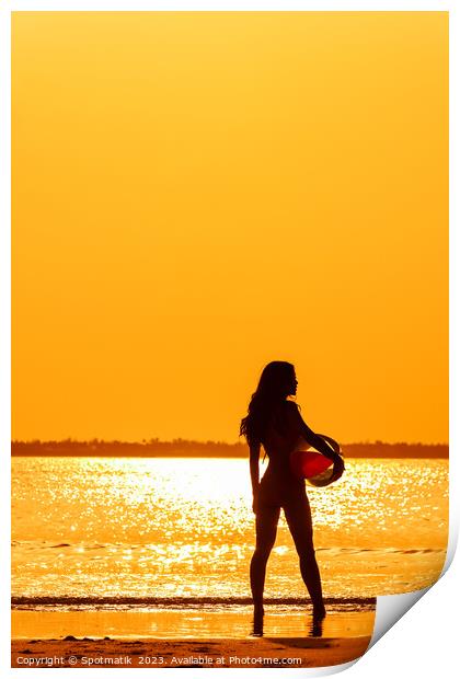 Tropical ocean sunrise with girl holding beach ball Print by Spotmatik 