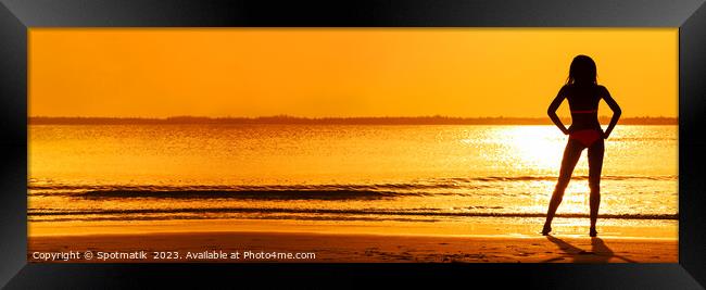 Panoramic silhouette of girl watching tropical ocean sunset Framed Print by Spotmatik 
