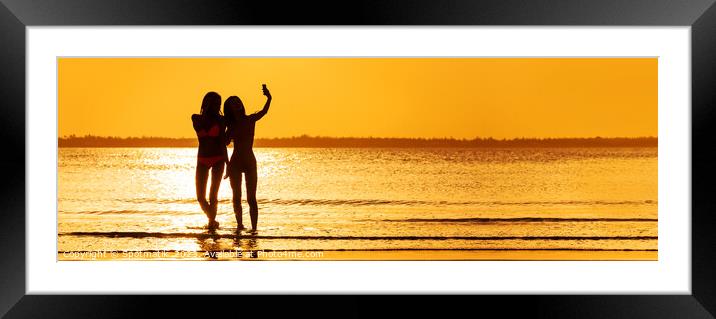 Panoramic ocean sunrise with females silhouette taking selfie Framed Mounted Print by Spotmatik 