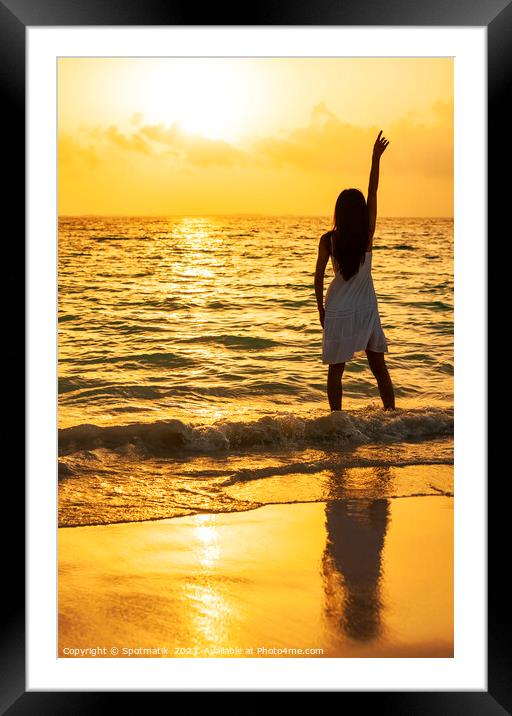 Young Asian woman enjoying ocean sunset on vacation Framed Mounted Print by Spotmatik 