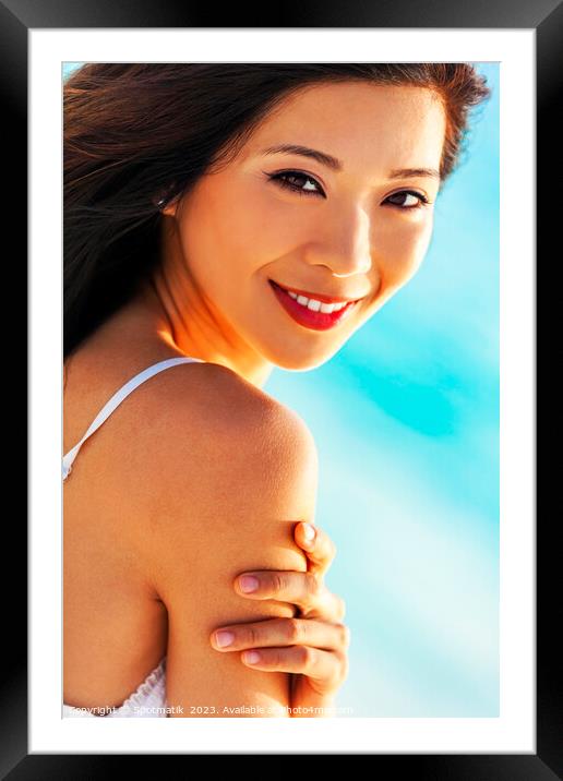 Portrait of smiling Asian girl on relaxing vacation Framed Mounted Print by Spotmatik 