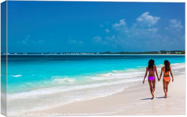 Tropical beach resort with girls walking by ocean Canvas Print by Spotmatik 
