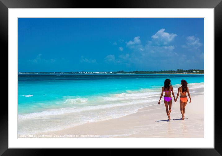 Tropical beach resort with girls walking by ocean Framed Mounted Print by Spotmatik 