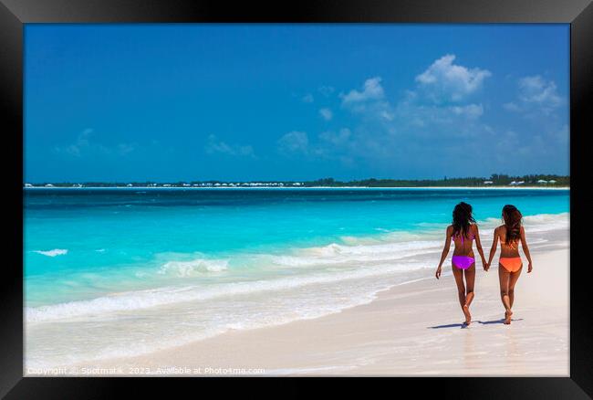 Tropical beach resort with girls walking by ocean Framed Print by Spotmatik 