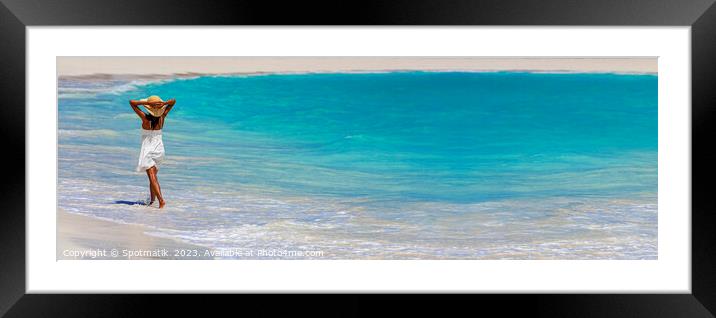 Panoramic ocean with young female walking in waves Framed Mounted Print by Spotmatik 