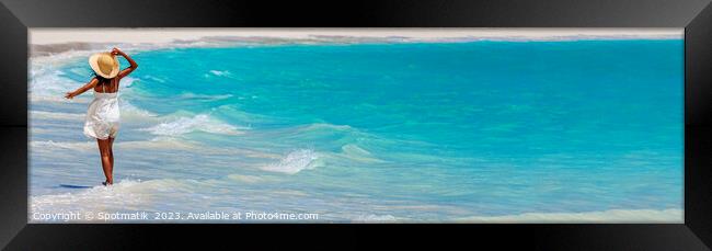 Panoramic happy girl walking through waves on beach Framed Print by Spotmatik 