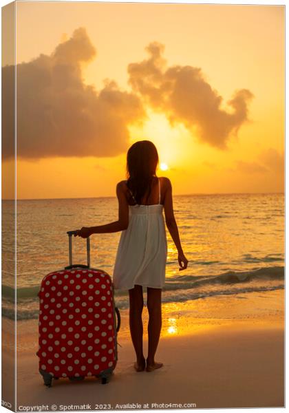 Young woman with suitcase enjoying tropical ocean sunrise Canvas Print by Spotmatik 