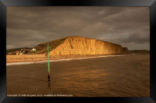 Crumbling Cliffs: West Bay's Dramatic Landscape Framed Print by Holly Burgess
