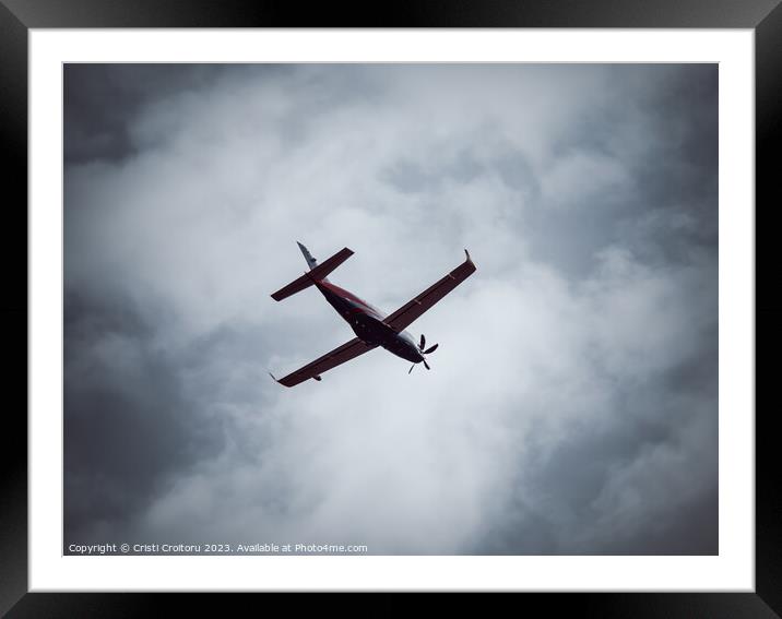 Turboprop airplane flaying Framed Mounted Print by Cristi Croitoru