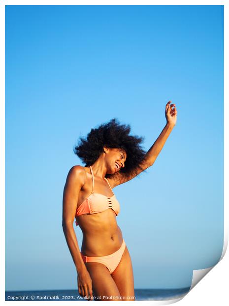 Afro girl in swimwear dancing on the beach Print by Spotmatik 