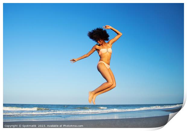 Afro American woman jumping for joy on beach Print by Spotmatik 
