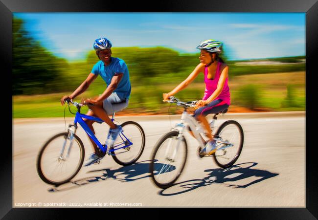 African American couple keeping fit riding bikes together Framed Print by Spotmatik 