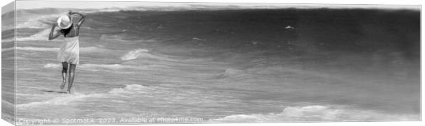 Happy young female walking through waves on beach Canvas Print by Spotmatik 