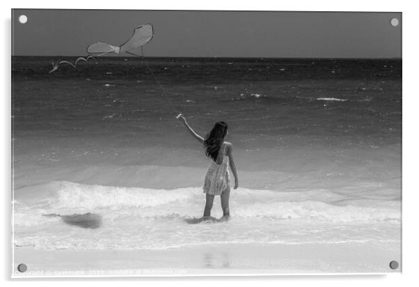 Tropical ocean view with young woman flying kite Acrylic by Spotmatik 